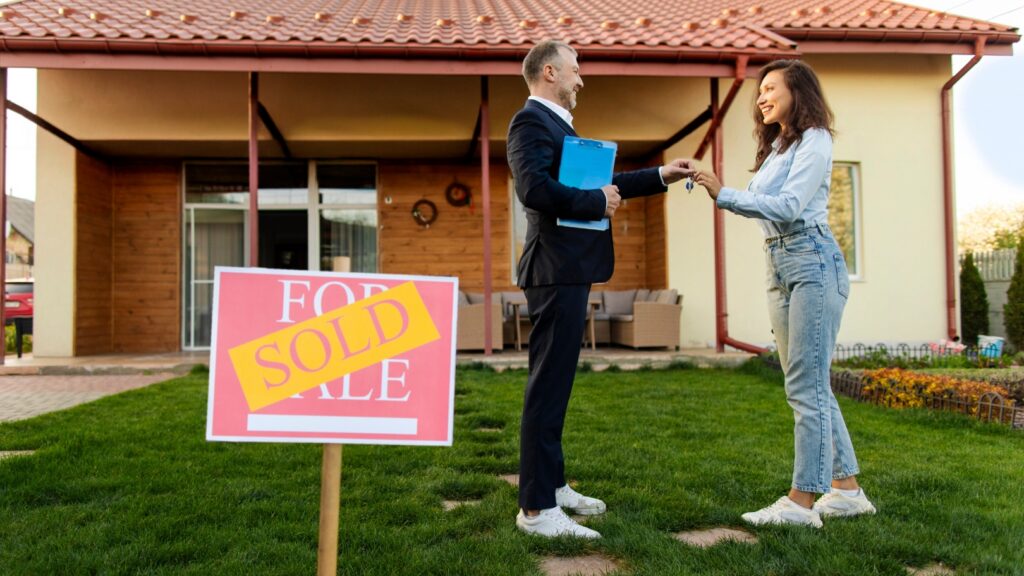 Homeowner preparing their Long Island house for sale with a sold sign in the front yard